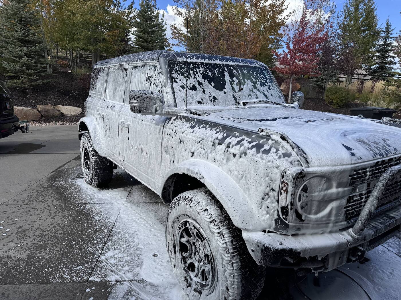 Ford Bronco covered in snow foam during a 3-step hand wash